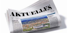 gefaltete Zeitung mit großer Titelüberschrift 'Aktuelles'